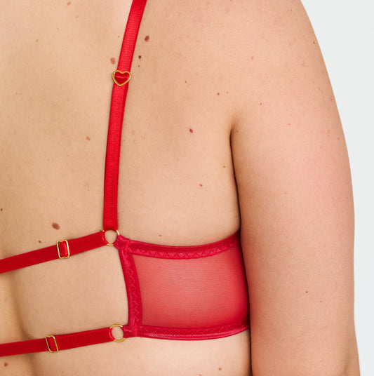 Red lingerie set on a plain background